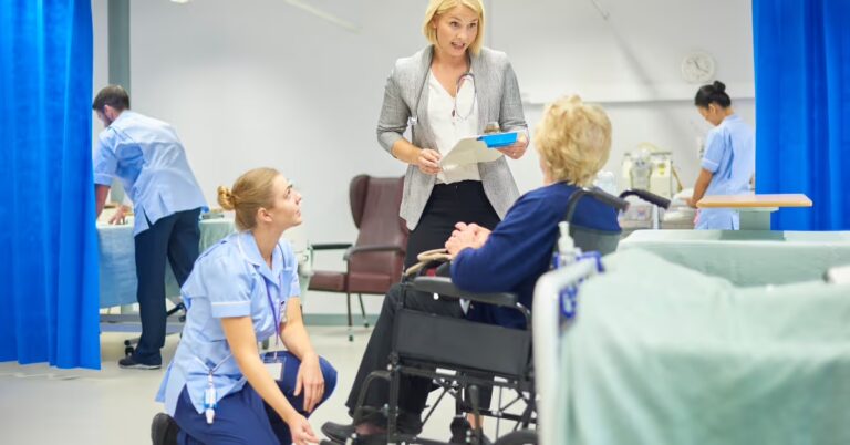 senior woman in wheel chair with nurse and doctor