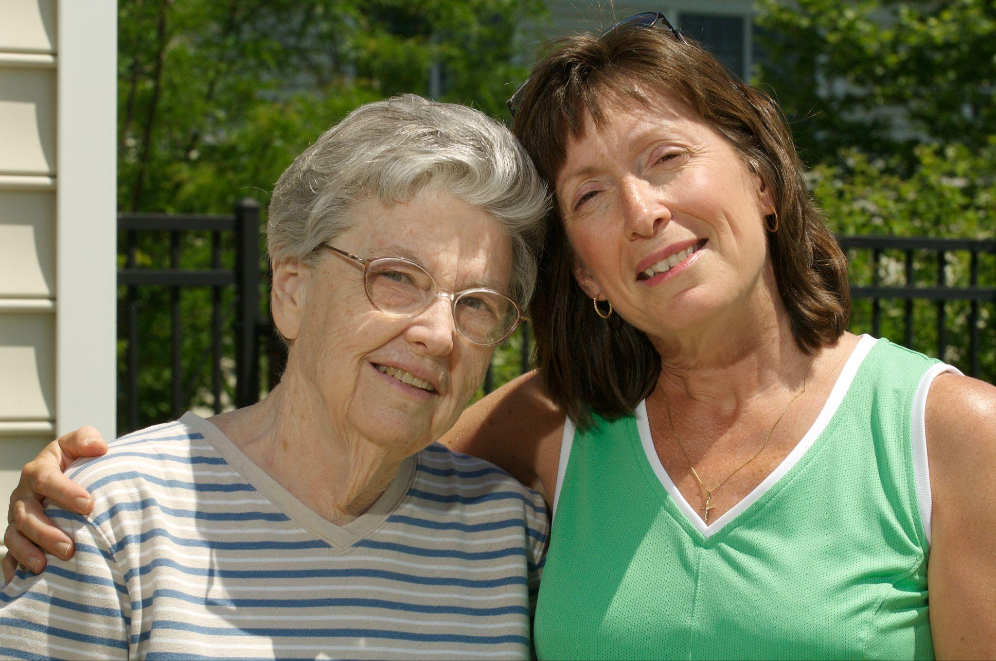 senior resident smiling with daughter