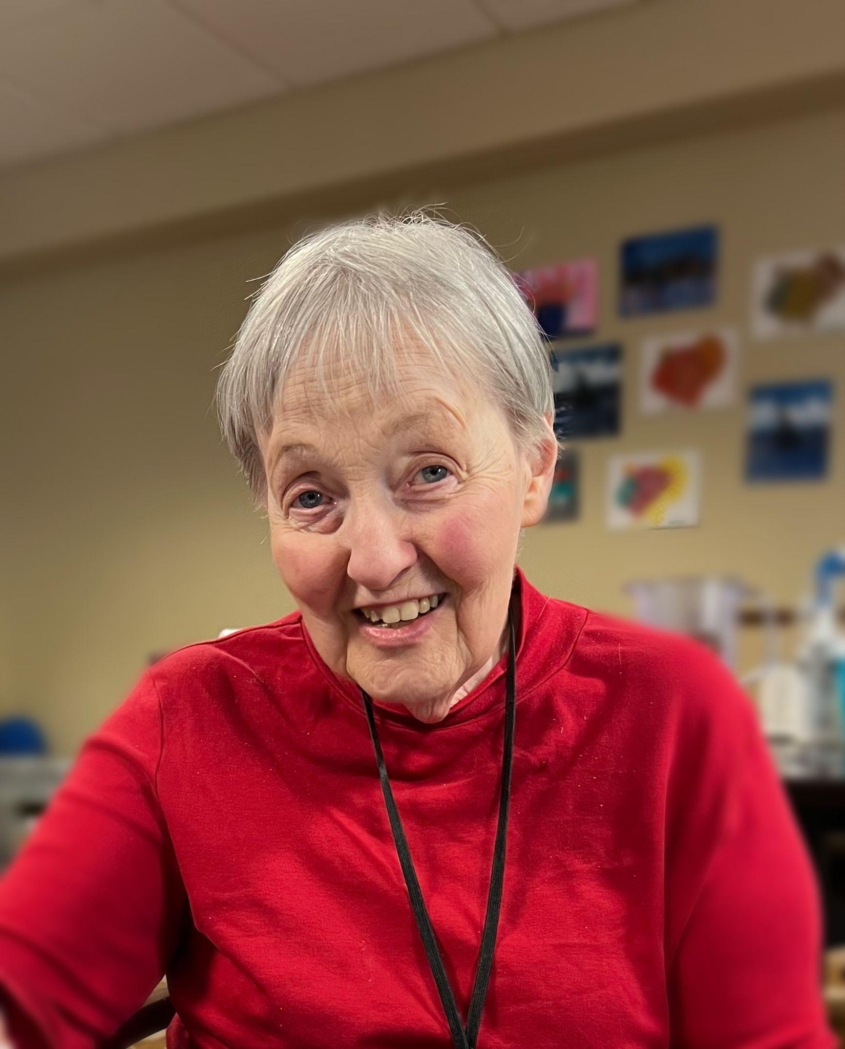 Senior woman in red sweater